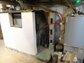 mason stove- side pocket over hearth 
                                           and tadelakt finish on masonblock wall